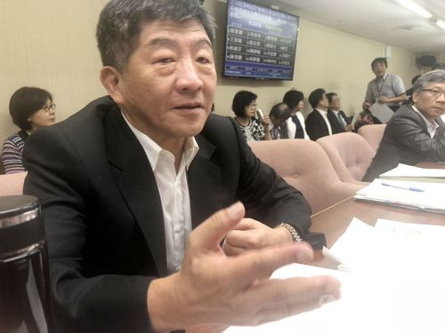 Minister of Health and Welfare Chen Shih-chung (陳時中, front)