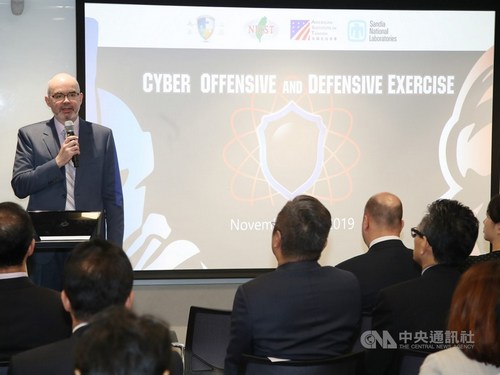 American Institute in Taiwan (AIT) Acting Director Raymond Greene (standing)