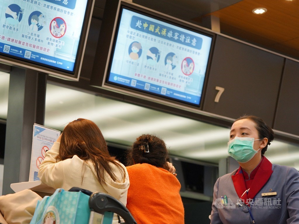 Passengers in front of a Mandarin Airlines counter at the Taipei Songshan Airport on Wednesday