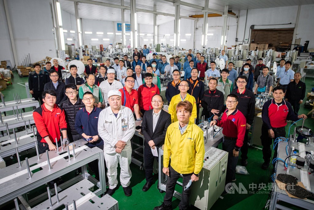 Engineers tasked with assembling mask production units at a factory in New Taipei.