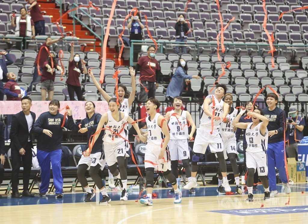 Shih Hsin University players cheer for the win.