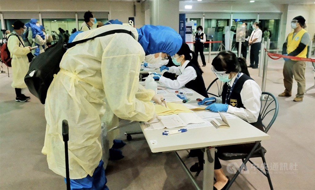 Passengers go through health screening process.