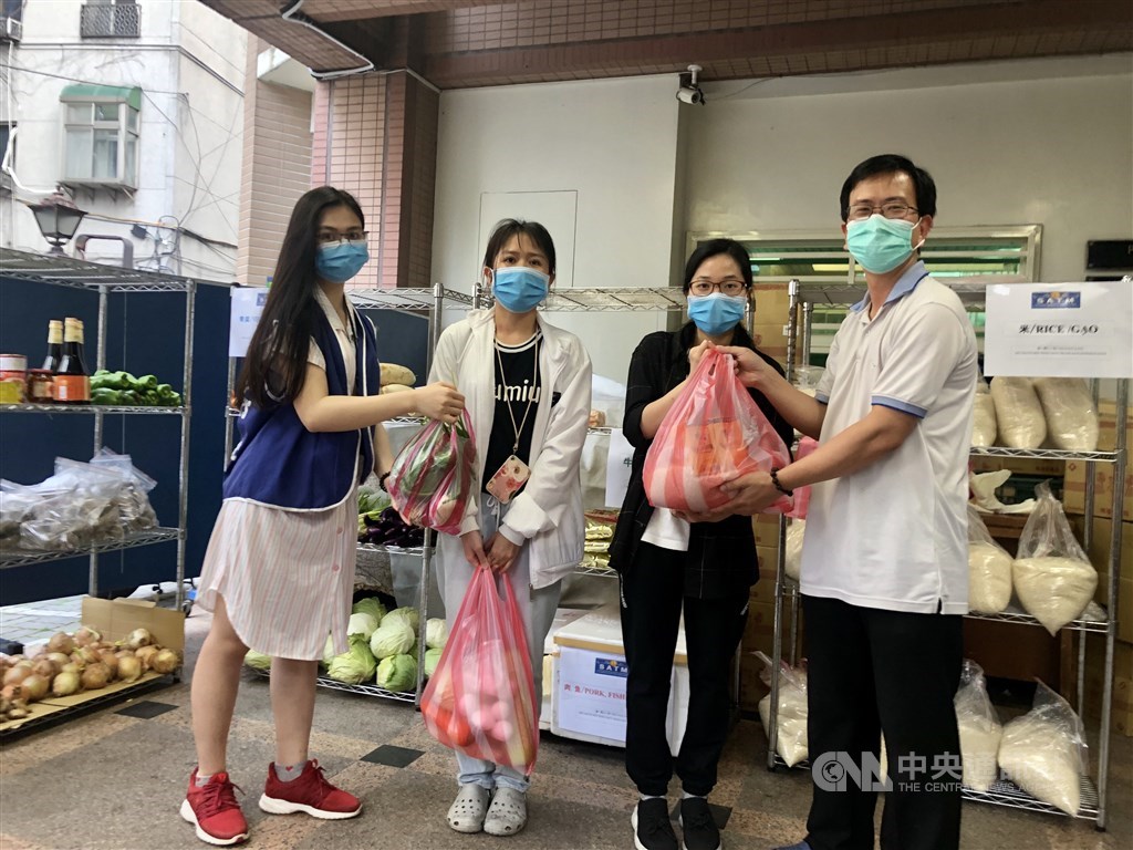 International students pick up free groceries at Saint Christopher