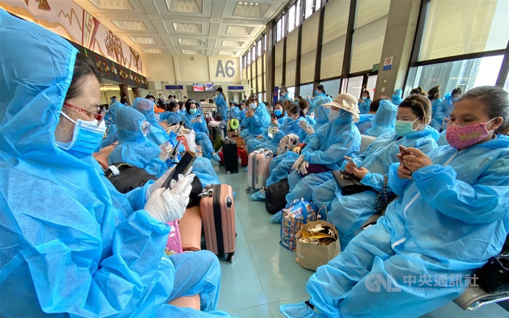 Passengers in the departure lounge before boarding the flight back to Vietnam.