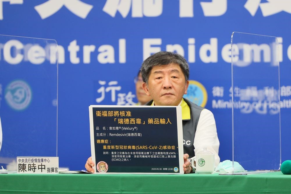 Minister of Health and Welfare Chen Shih-chung (陳時中) shows a board explaining his ministry