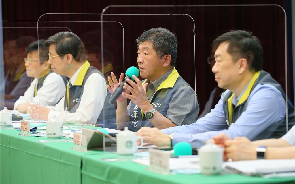 Health Minister Chen Shih-chung (center) speaks during the CECC