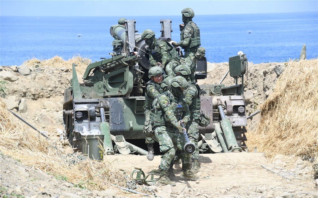 Soldiers load a cannon during 2019
