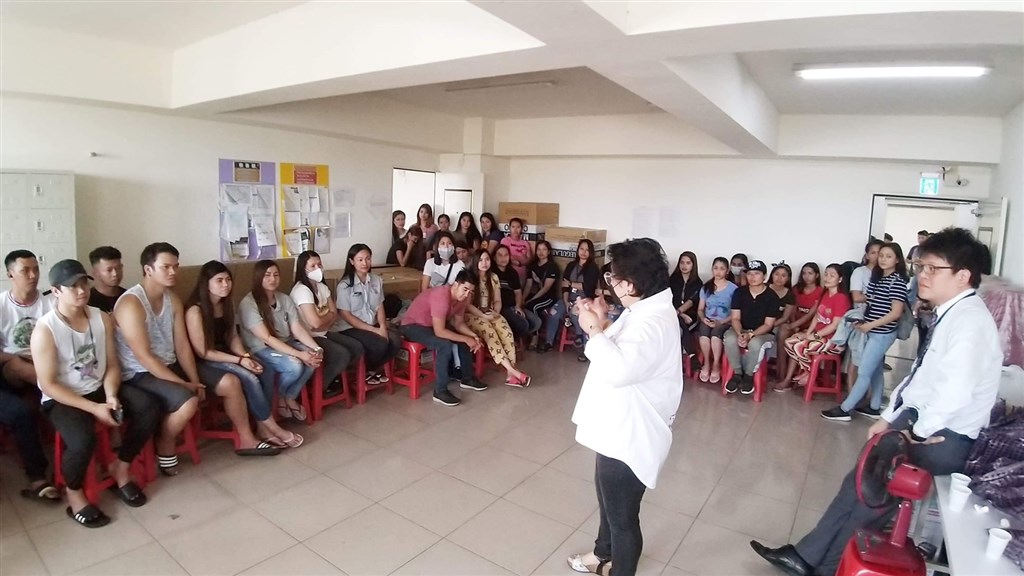 Manila Economic and Cultural Office (MECO) Taipei Labor Center Deputy Director Dayang Dayang Sittie Kaushar G. Jaafar speaks to migrant workers from the Philippines at a factory dormitory. Photo courtesy of MECO.