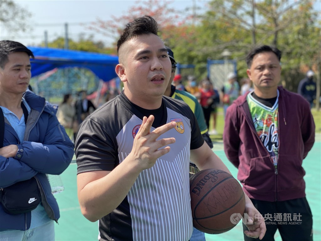 Referee Mark (front) speaks to the players and goes over ground rules before the championship game. CNA photo March 14, 2021