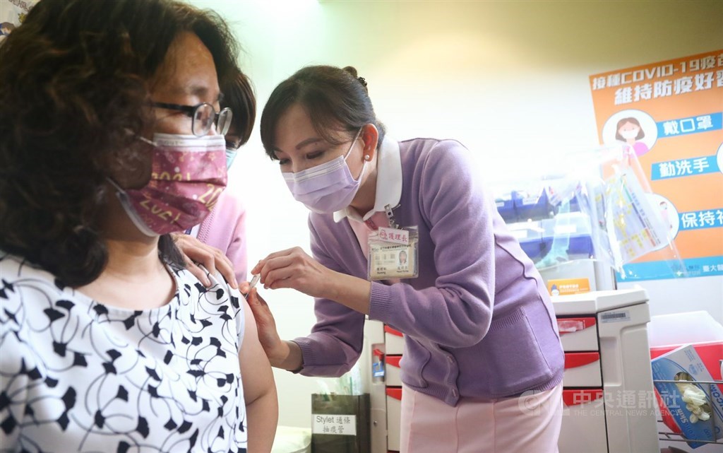 A woman receives the COVID-19 vaccine when Taiwan began the rollout of the vaccination March 22. CNA file photo
