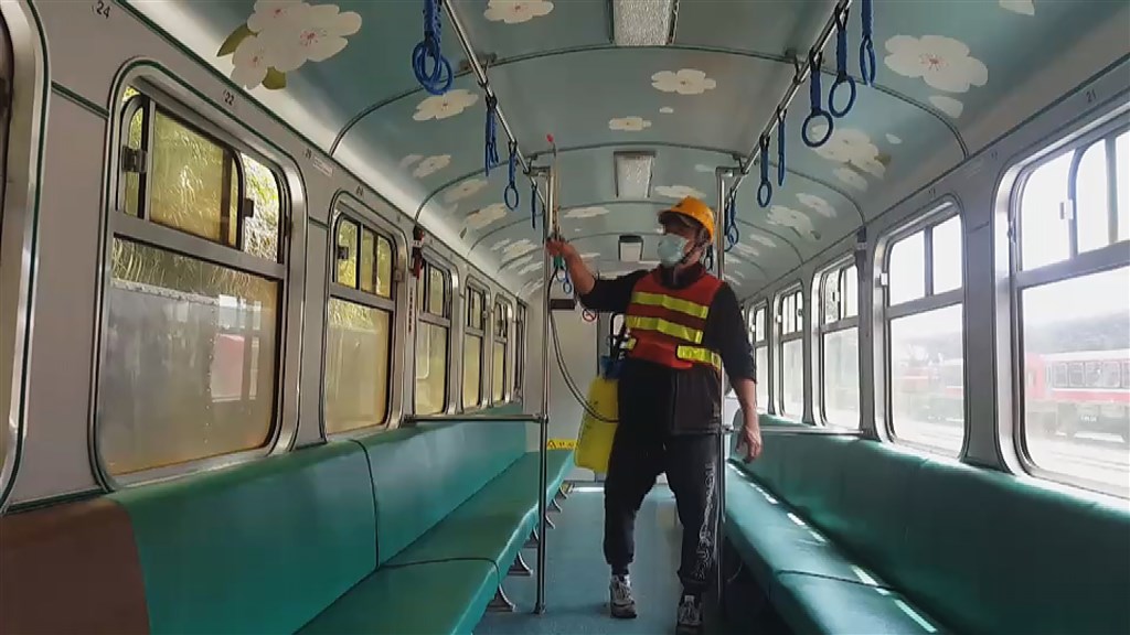 A worker cleans inside a carriage of a Alishan Railway train. Photo courtesy of the Alishan Forest Railway and Cultural Heritage Office