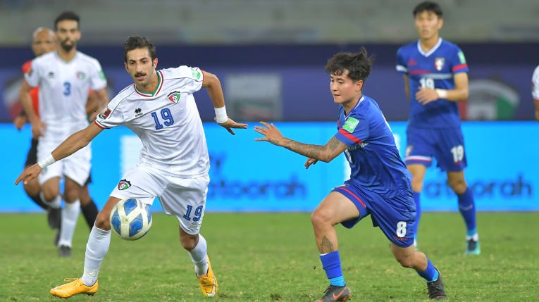 Taiwan midfielder Emilio Estevez Tsai (蔡立靖, front, right) chases for possession of the ball against Kuwait forward Ahmad Zanki (front, left). Photo courtesy of Kuwait Football Association
