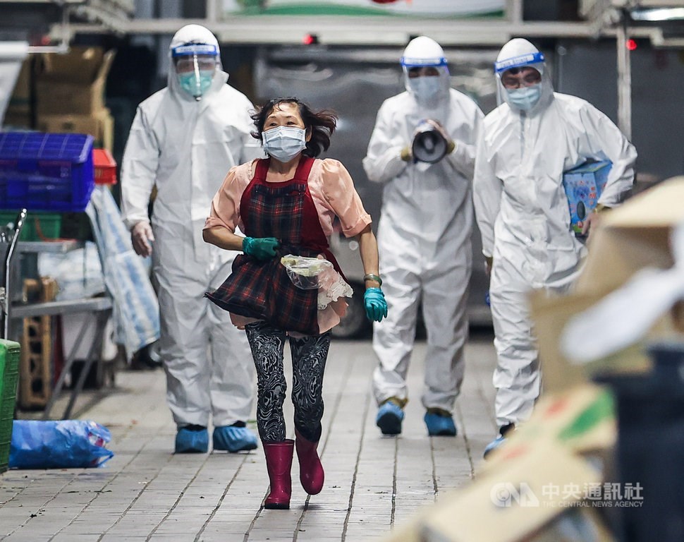 Disinfection workers at the Huannan Market in Taipei