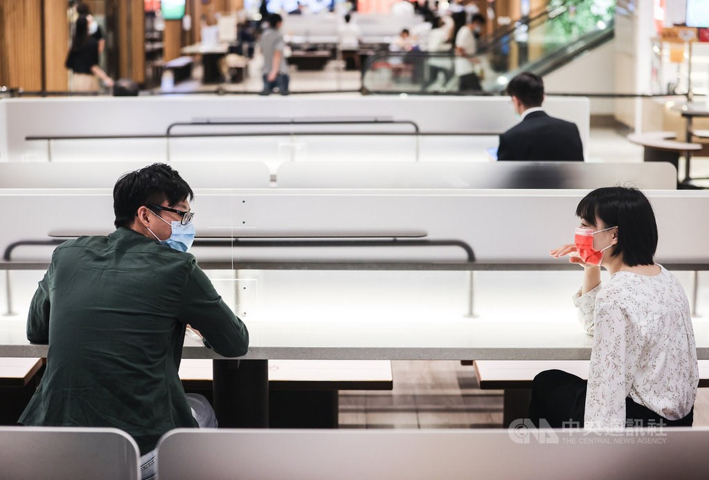People sit in Taipei 101