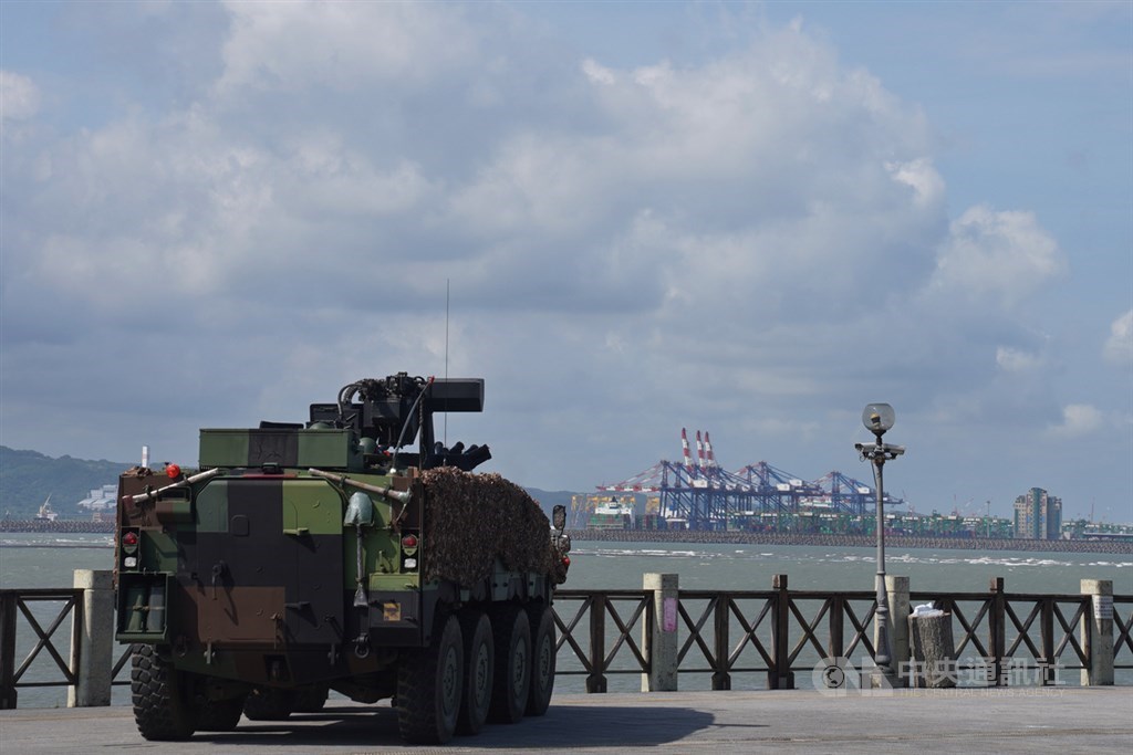 An armed vehicle is pictured by the Tamsui River with the Taipei Port on the far side. CNA photo Sept. 14, 2021
