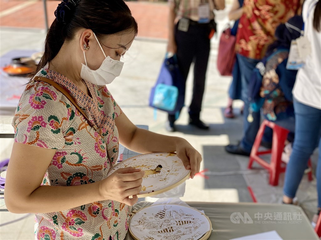 A woman makes her batik designs. CNA photo Oct. 3, 2021