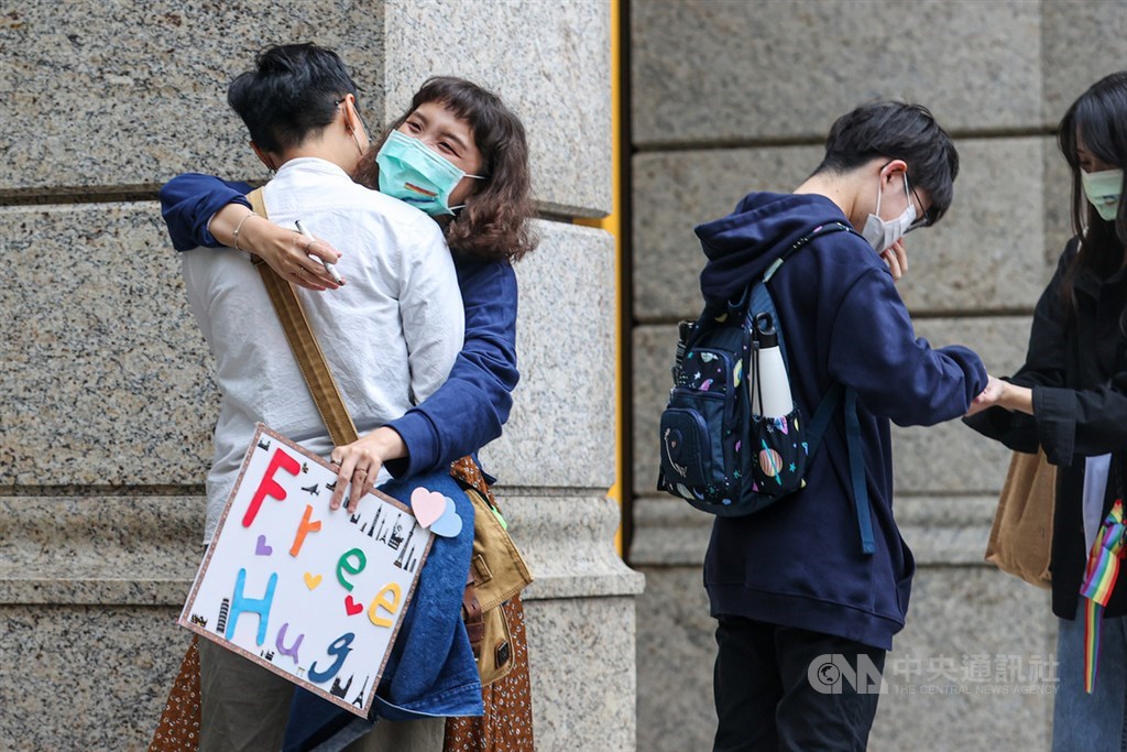 Some students offer free hugs on the streets in Taipei, as their way to participate on the day of the pride parade. CNA photo Oct. 30, 2021