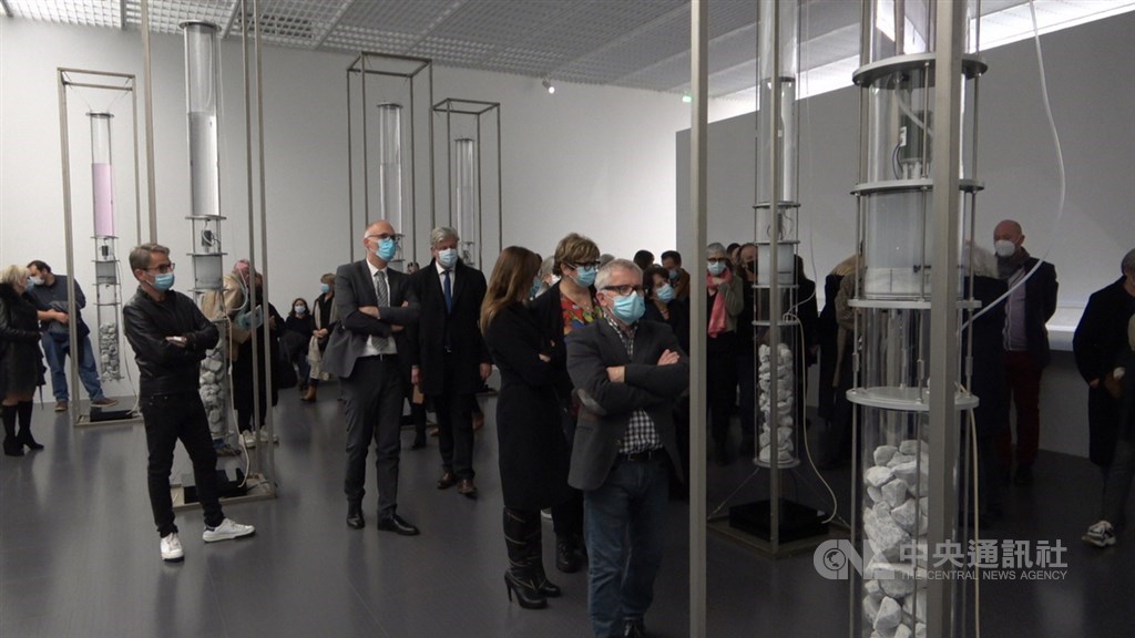 People attending a preview of the event look at artist Chang Yung-ta