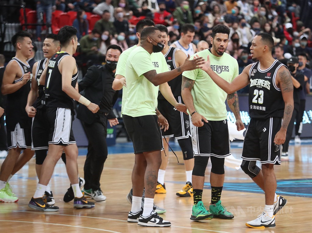 The Dreamers celebrate their season opening win. CNA photo Dec. 4, 2021