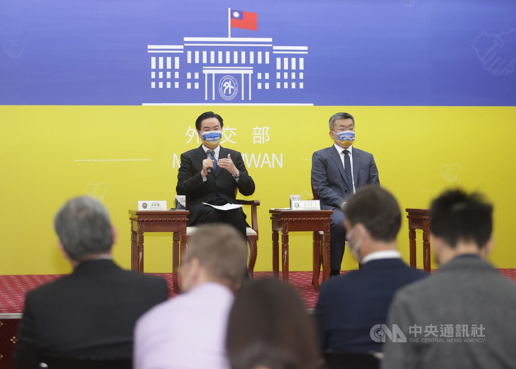 Foreign Minister Joseph Wu (left) speaks at a press event held by the Ministry of Foreign Affairs in Taipei on Monday