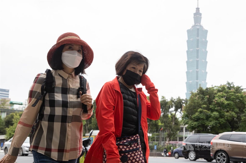 People in Taipei are seen wearing a face mask as mandated for most settings outside one