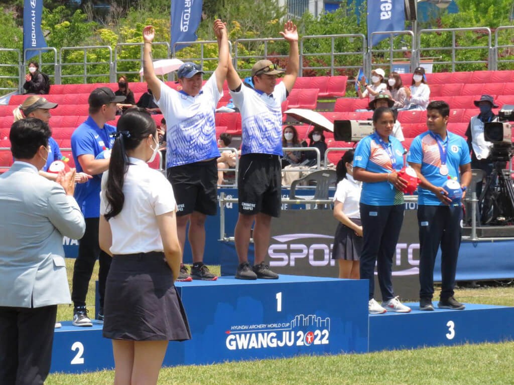 Taiwanese archers Huang I-jou (center left) and Chen Chieh-lun (center right) cheer on the podium after winning a gold medal at the Archery World Cup in Gwangju, South Korea on Saturday. Photo courtesy of the Chinese Taipei Archery Association