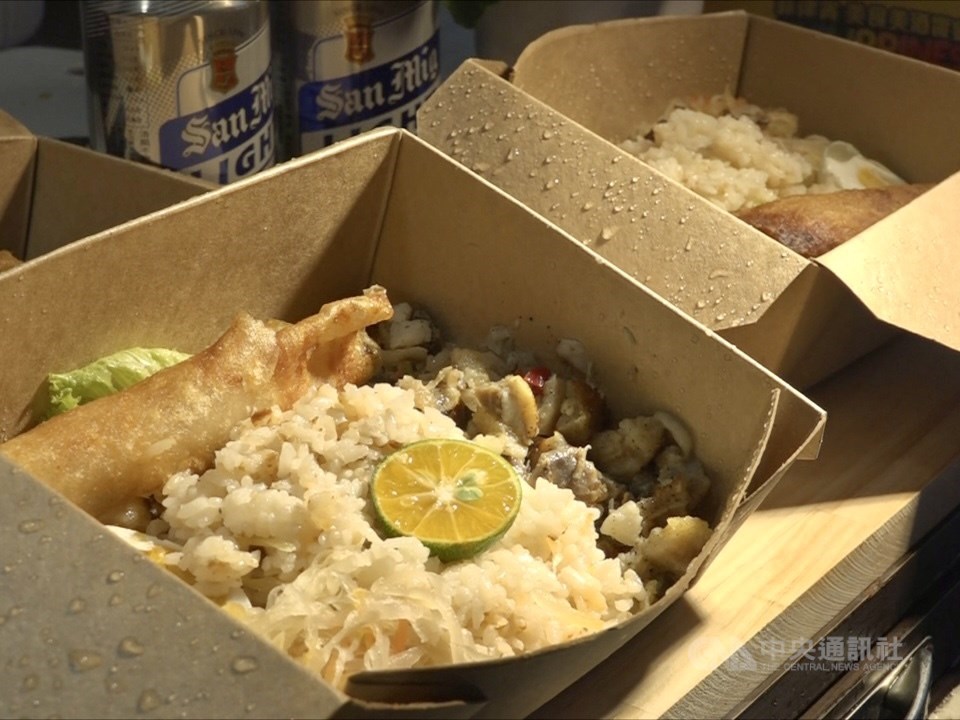 Pork sisig served with garlic rice, salted eggs, atchara, and turon. CNA photo June 9, 2022