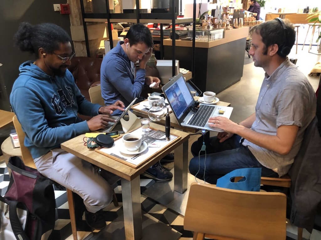 Benjamin (right) and his classmates gather in a coffee shop in Paris for their online presentation at the end of the course. Photo courtesy of Bejamin