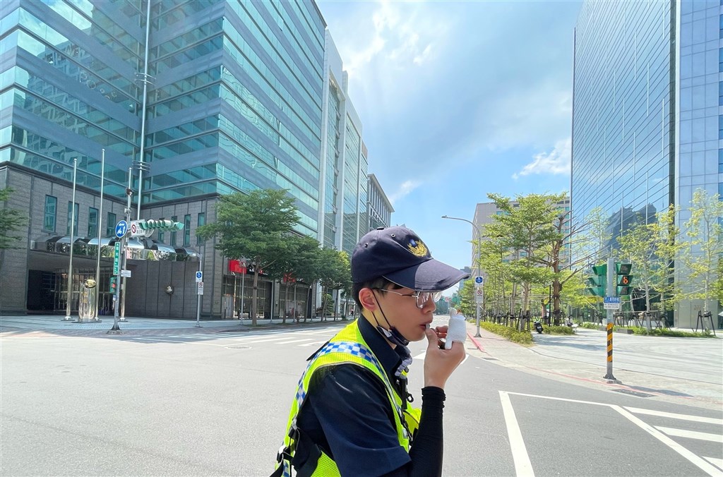 A policeman directs traffic in Taipei