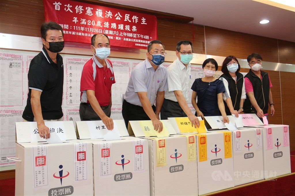 Miaoli County officials explain the different colors of the ballots and ballot boxes to be used in Taiwan