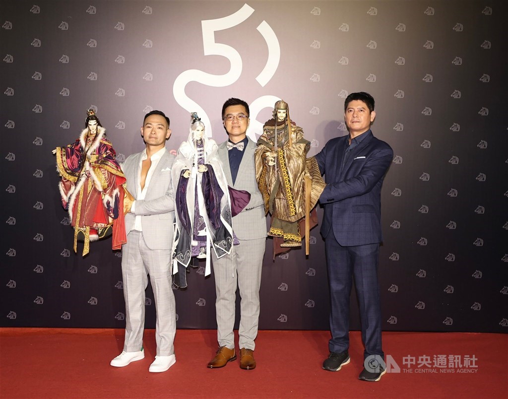 Members of the production behind "DEMIGOD: The Legend Begins" takes the glove puppet used in the film to the awards ceremony in Taipei on Saturday. The film received three nomination. CNA photo Nov. 19, 2022
