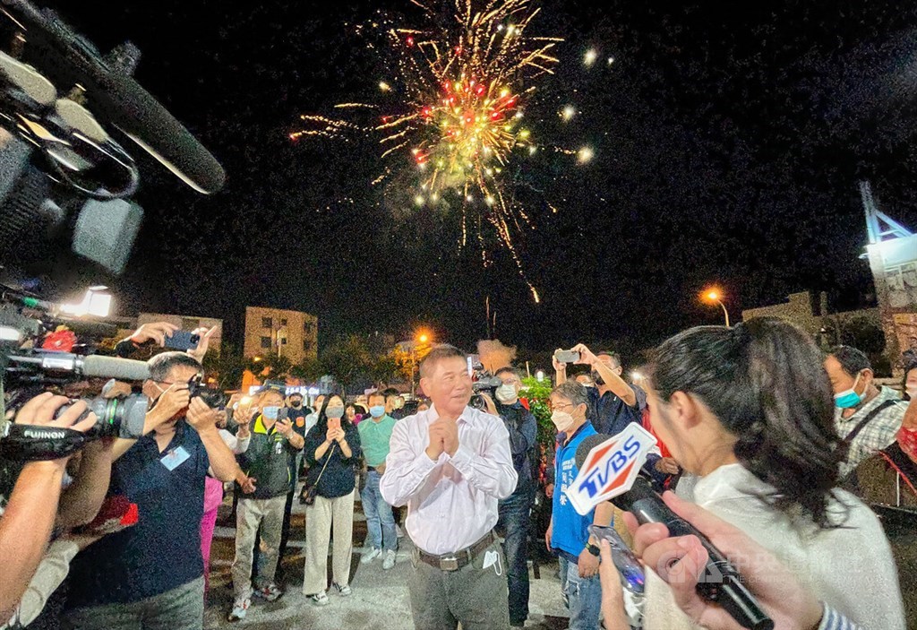 Fireworks are set off outside independent Miaoli County magistrate candidate Chung Tung-chin