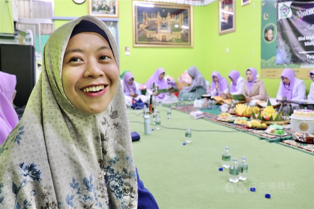 Indonesian caretaker Lisa Mukhlisoh takes part in a religious event in Taipei on Dec. 11