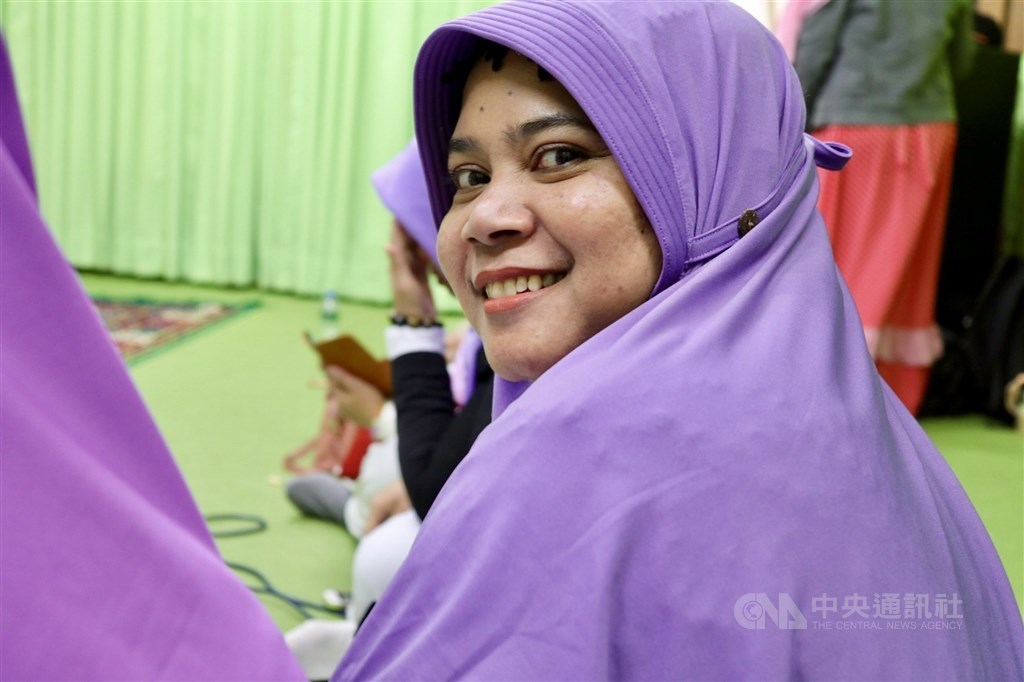 Indonesian caretaker Siti, who looks after an elderly Christian woman, is pictured at a gathering in Taipei on Dec. 11.