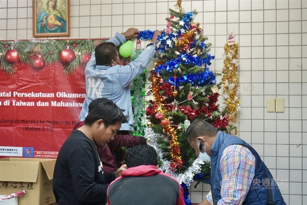 Christian Indonesian migrant fishers decorate a Christmas tree and other decorations for a special Christmas event in the northern port city of Keelung on Dec.10.