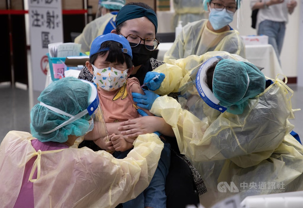 A boy is given a COVID-19 vaccine shot on June 1 at a mass vaccination site in Taipei. Taiwan began rolling out COVID-19 vaccines for children aged between 5 and 11 in May.