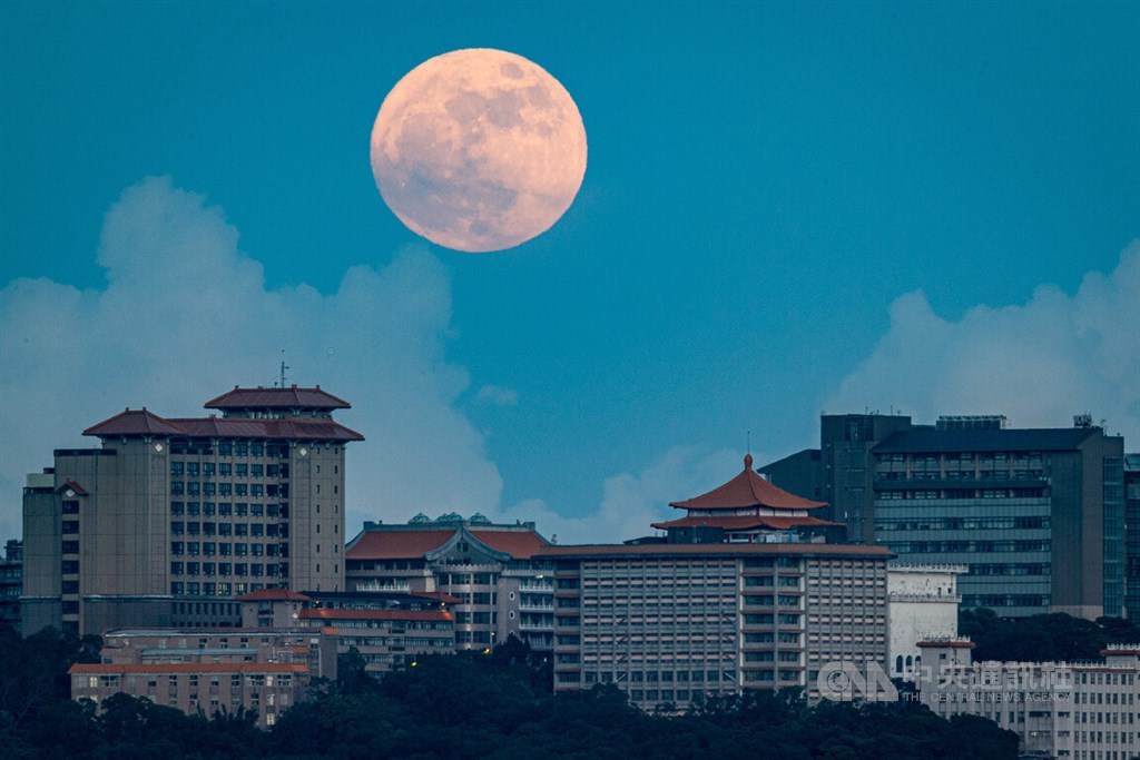 A full moon is seen over Chinese Culture University in Taipei on July 13. It was the largest super full moon of 2022, which occurs when a full moon is closer to Earth than usual.