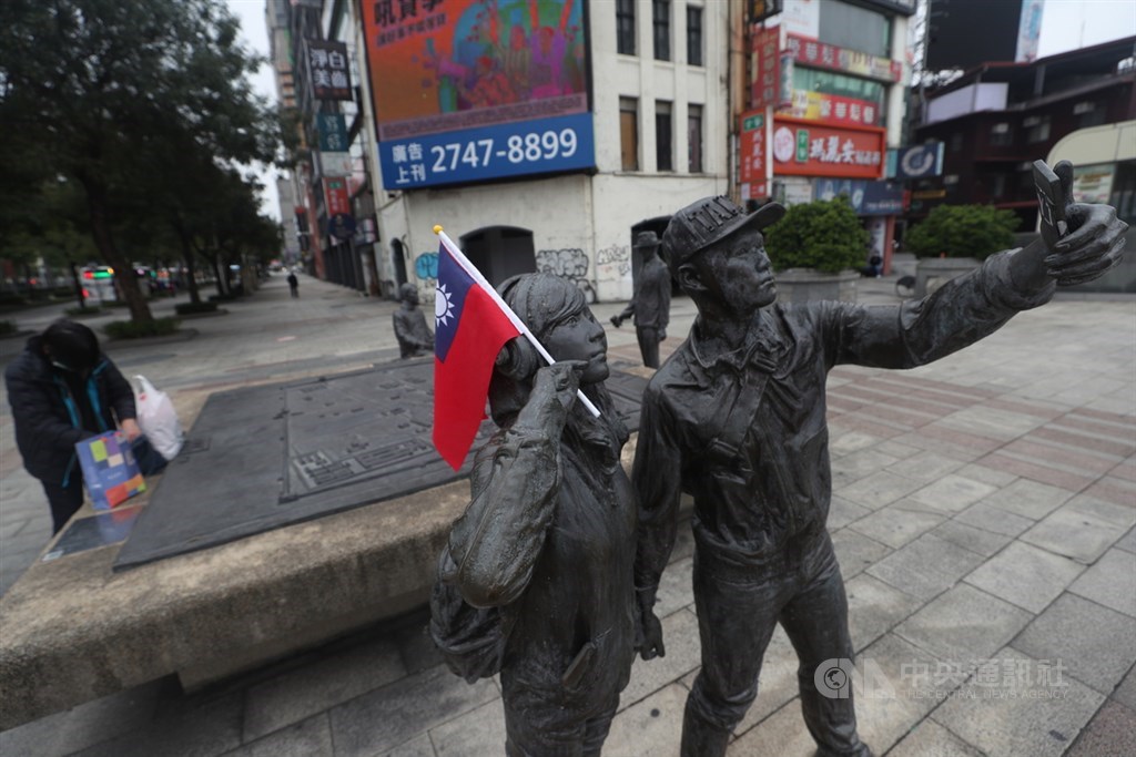 A Republic of China (Taiwan) national flag is placed on a public artwork near Ximen Station in Taipei on Jan. 1.