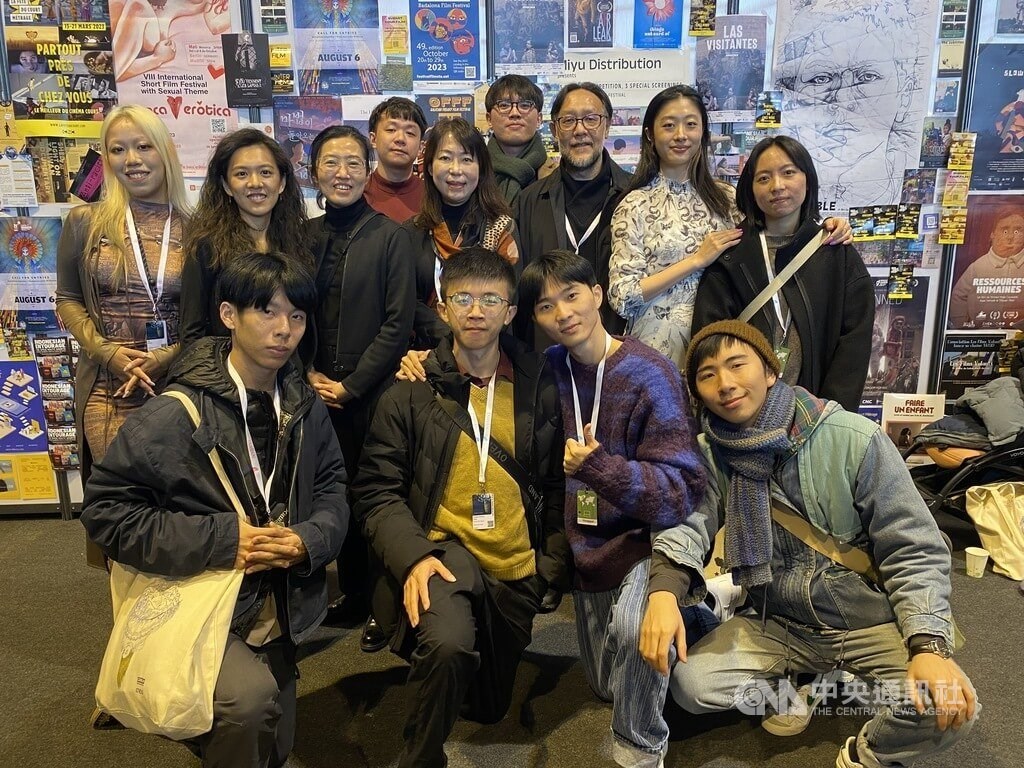 Students and teachers from the Taipei National University of the Arts pose for a group picture at the event. CNA photo Feb. 3, 2023