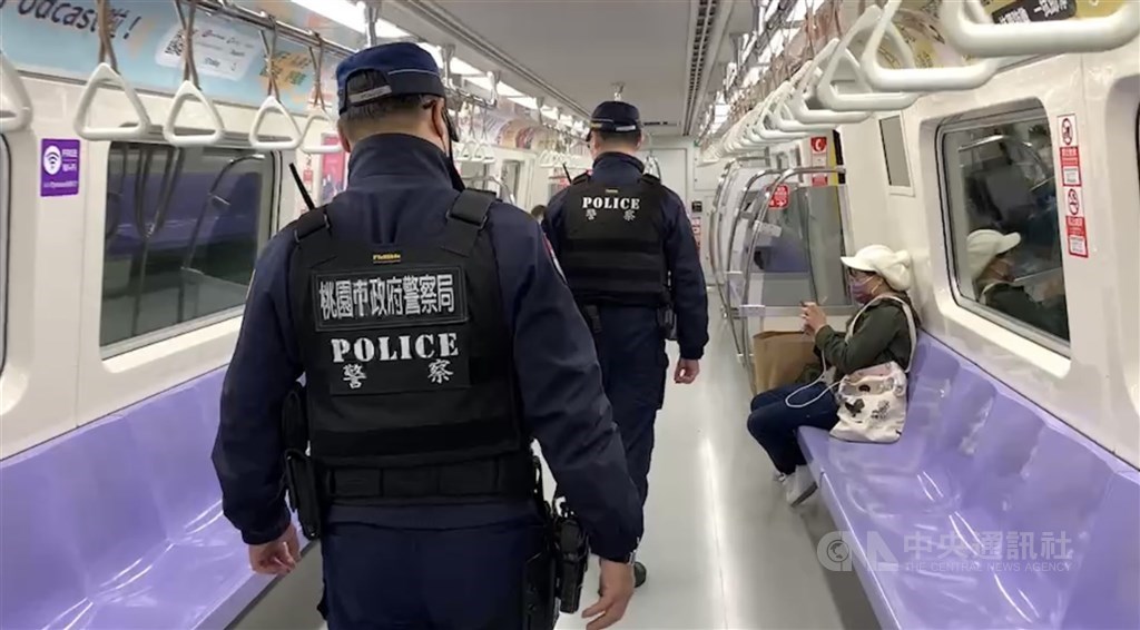 Police inspect a Taoyuan Airport MRT line train. CNA photo Feb. 3, 2023
