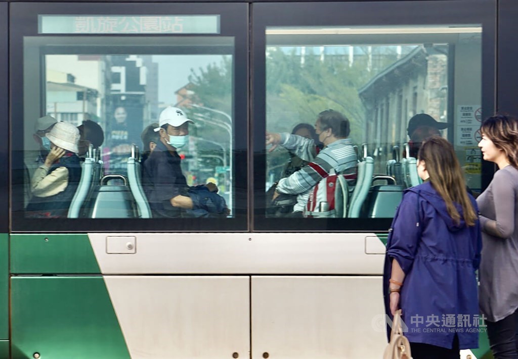 Passengers taking the tram in Kaohsiung wear a face mask on Monday since it is still required on public transportation. CNA photo Feb. 20, 2023