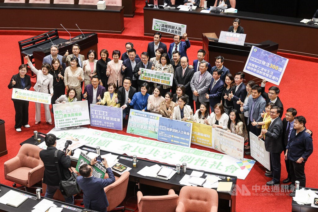 Legislators of the ruling Democratic Progressive Party pose for a group photo after the government