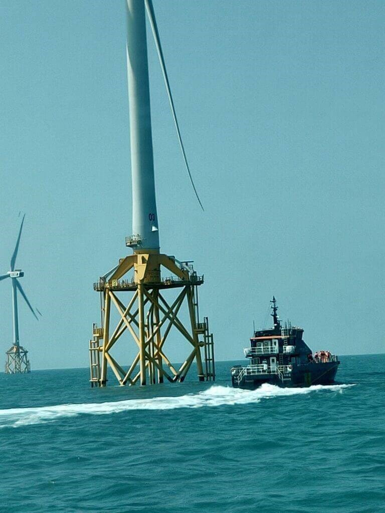 A boat sails by a wind turbine in a wind farm off the coast of Changhua County in this undated photo provided by local authorities in Taichung. One of the 16 bodies was found on the base structure of a wind turbine in the area on March 7.
