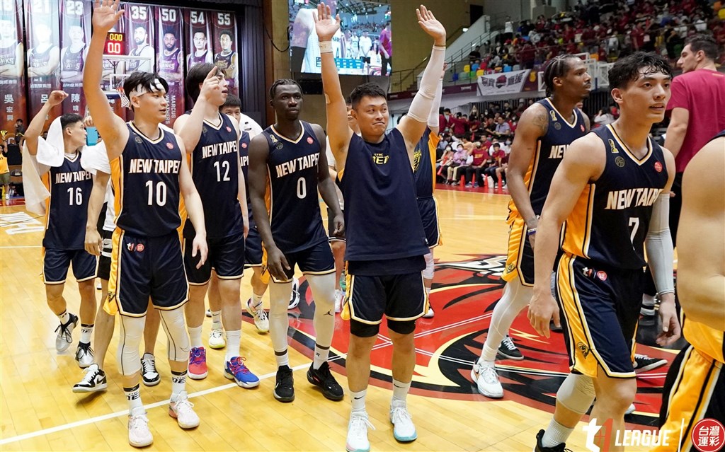 Players of the New Taipei CTBC DEA gather in the middle of the court and raise their hands to celebrate Friday