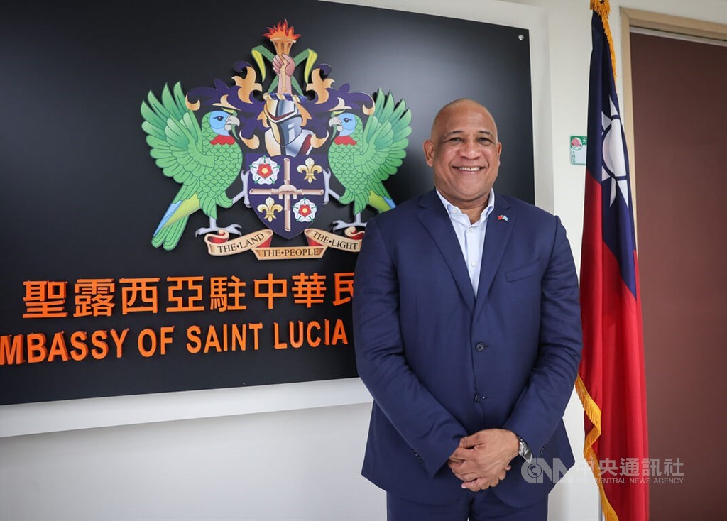 Visiting Saint Lucia Deputy Prime Minister Ernest Hilaire poses for photos at the Caribbean country
