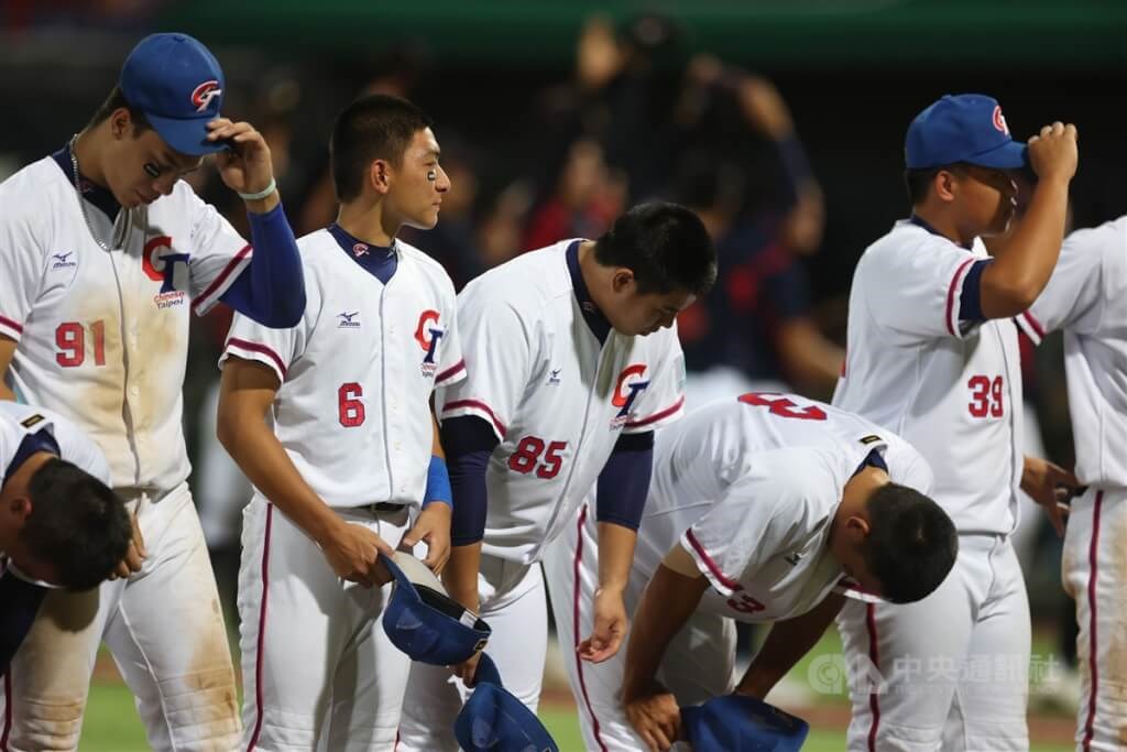 Japan national baseball team members celebrate after beating China