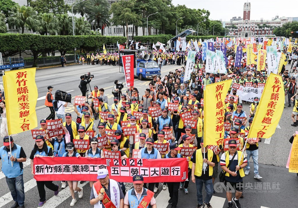 Labor Day marchers urge government action on minimum wage, pensions