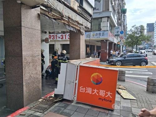 Falling telecom storefront sign injures two in Taipei
