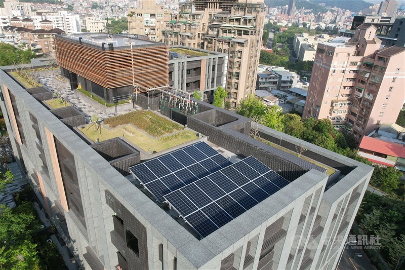 Rooftop solar panels are installed on a residential building in Taipei