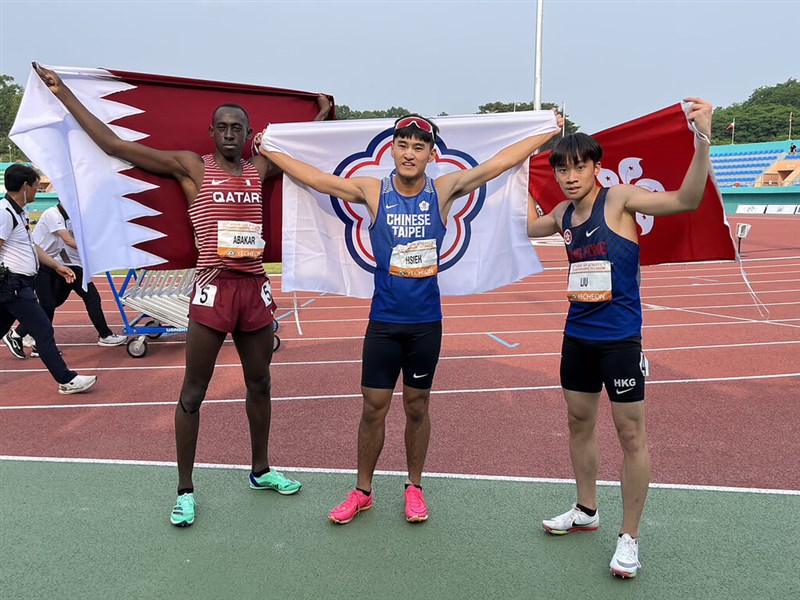 From left, Oumar Doudai O Abakar from Qatar, Hsieh Yuan-kai from Taiwan and Liu Hiu-long from Hong Kong celebrate after finishing second, first and third respectively in the men